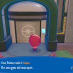 A character checking their pokemon pokopia trainer rank at a gate