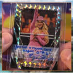 Even WWE legend Trish Stratus is throwing shade at GTA 6's delay. An image of the signed trading card.