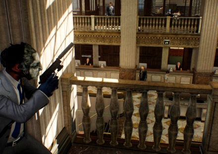 Payday 2 - A criminal in a suit takes cover in the upstairs of a large bank.