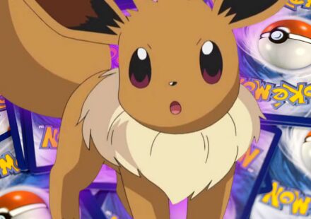 An image of Eevee on top of several Pokemon TCG cards piled up face down