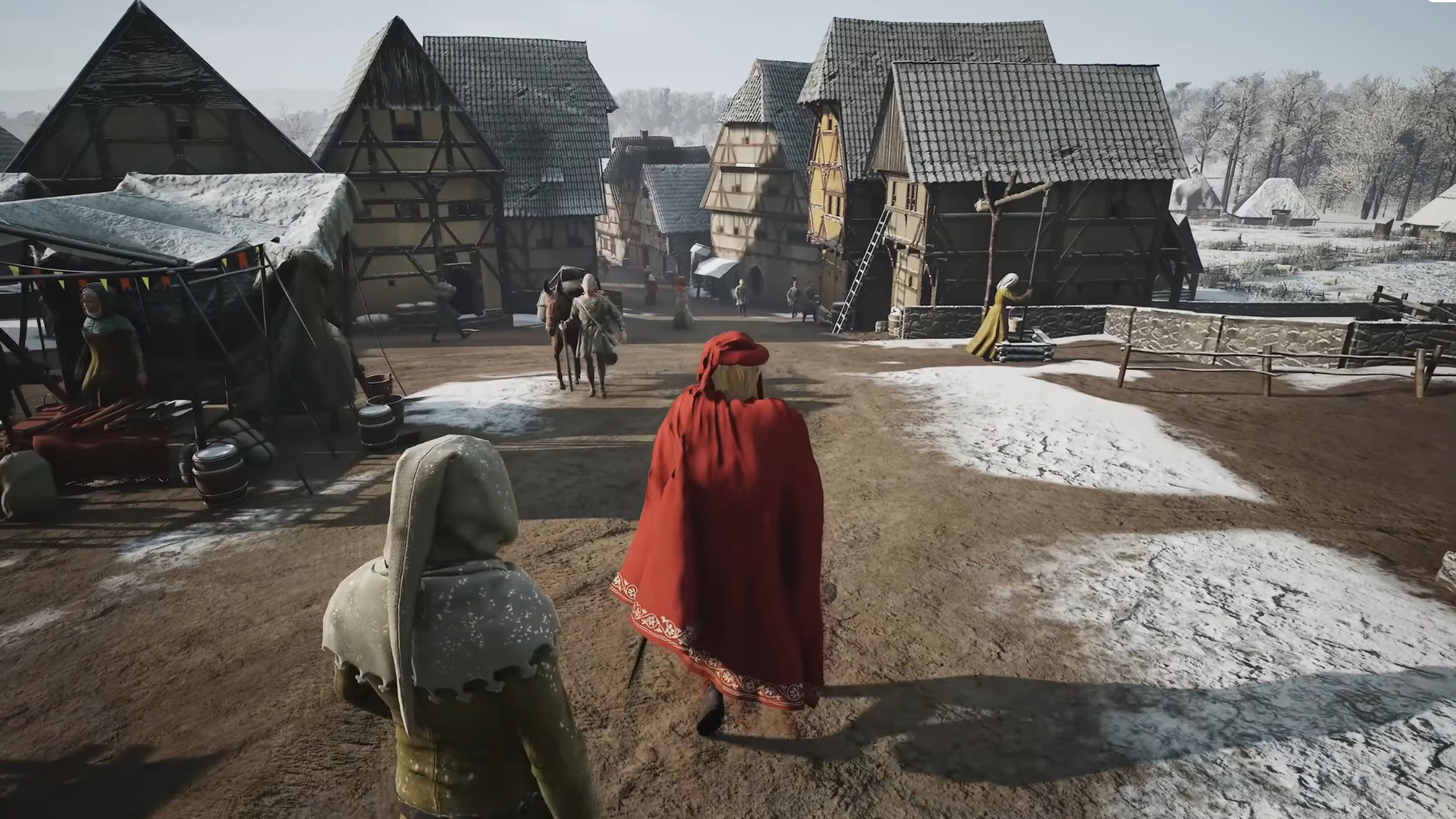 Manor Lords update 7 patch notes - A noble in red walks through a snowy village.